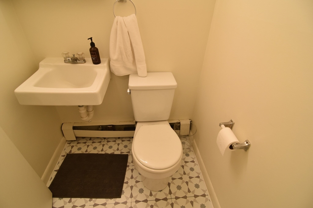 24 Highland Avenue, Unit 5 Cambridge, MA 02139 - Photo 6 of 9 a bathroom with a toilet and a sink