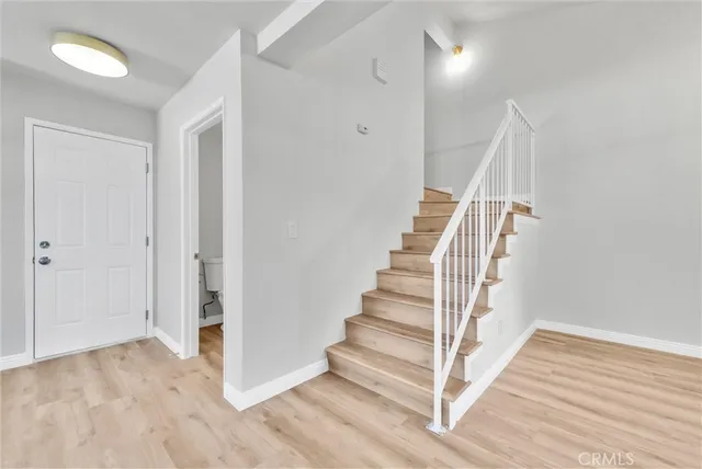 a view of entryway with wooden floor