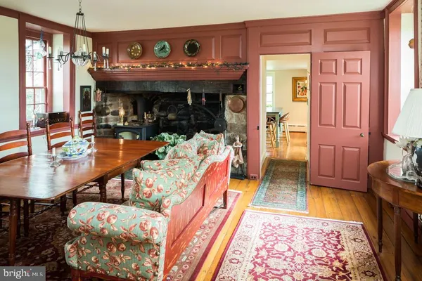 a living room with furniture rug and a fireplace