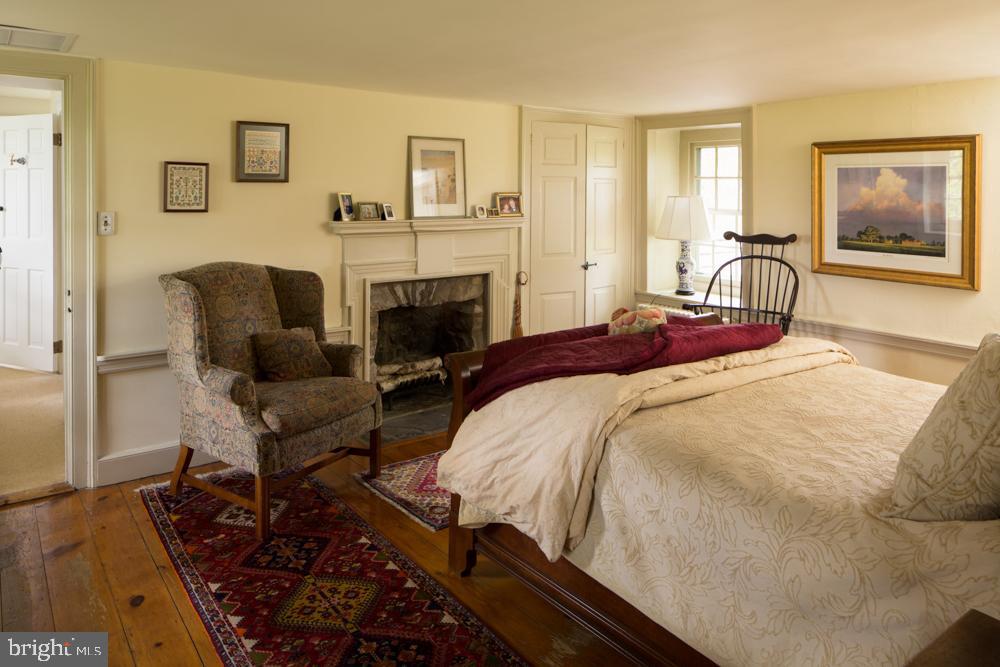 5736 Stoney Hill Road New Hope, PA 18938 - Photo 14 of 22 a bedroom with a bed and a couch