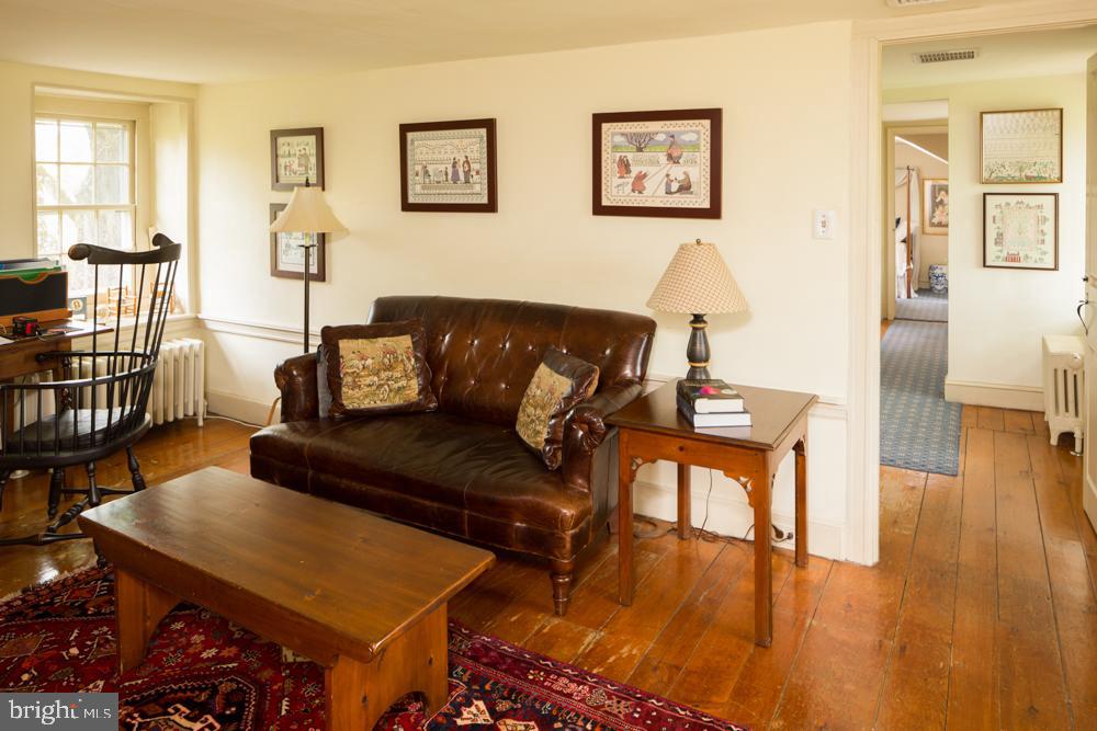 5736 Stoney Hill Road New Hope, PA 18938 - Photo 15 of 22 a living room with furniture and a wooden floor