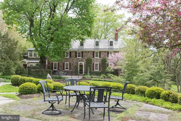 a view of swimming pool with outdoor seating and plants