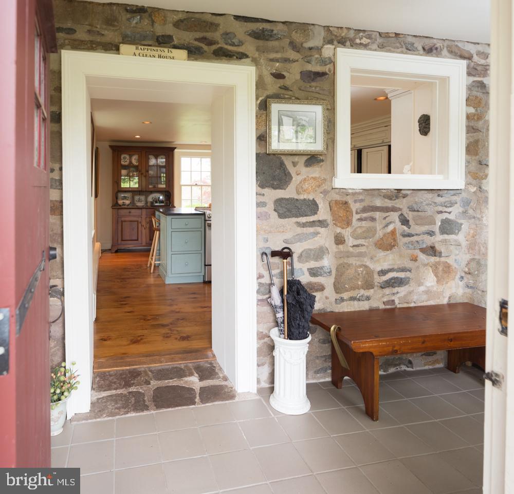 5736 Stoney Hill Road New Hope, PA 18938 - Photo 5 of 22 a living room with furniture and a fireplace