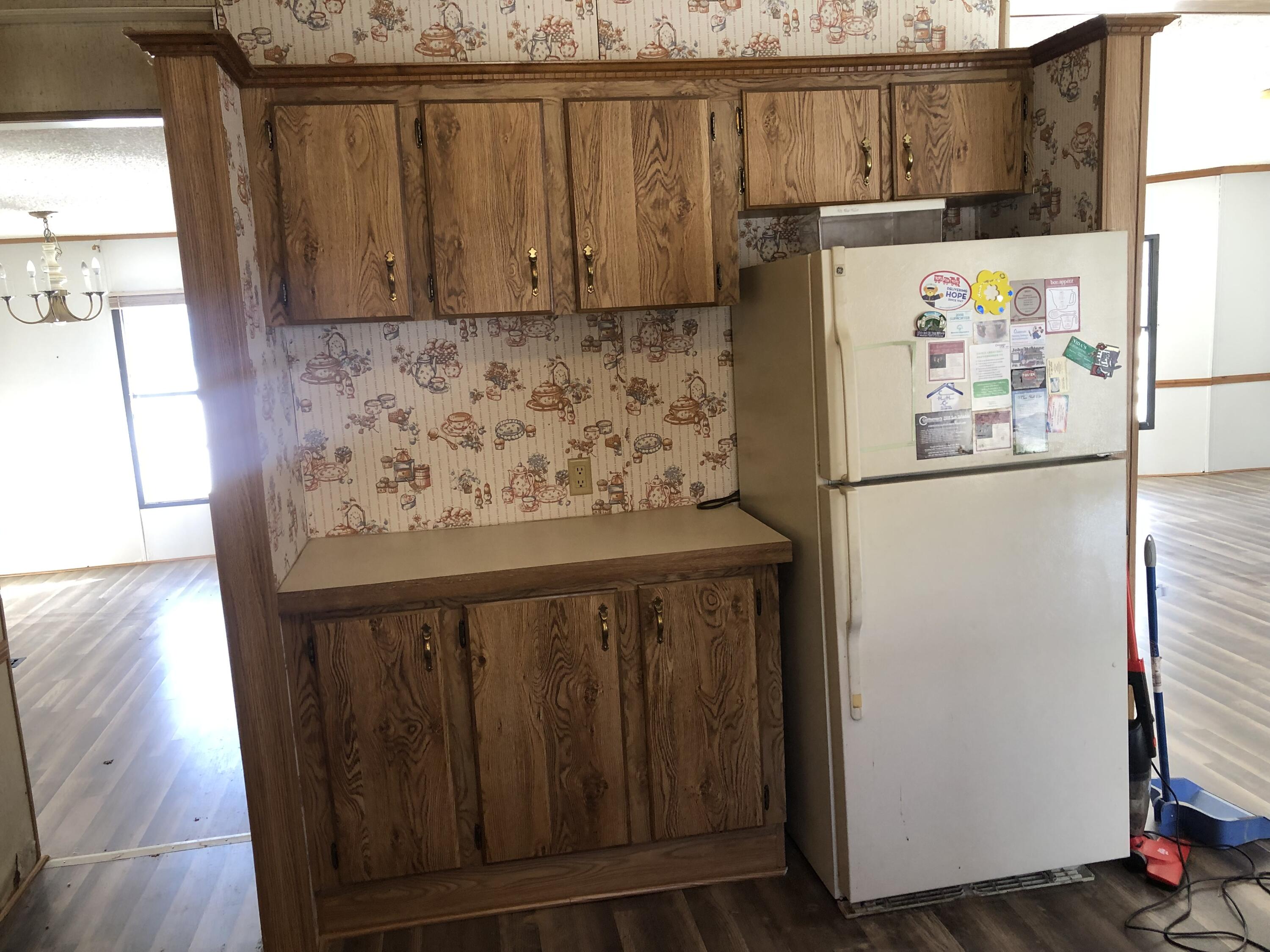 9210 Potts Creek Road Covington, VA 24426 - Photo 13 of 28 a white refrigerator freezer sitting inside of a kitchen