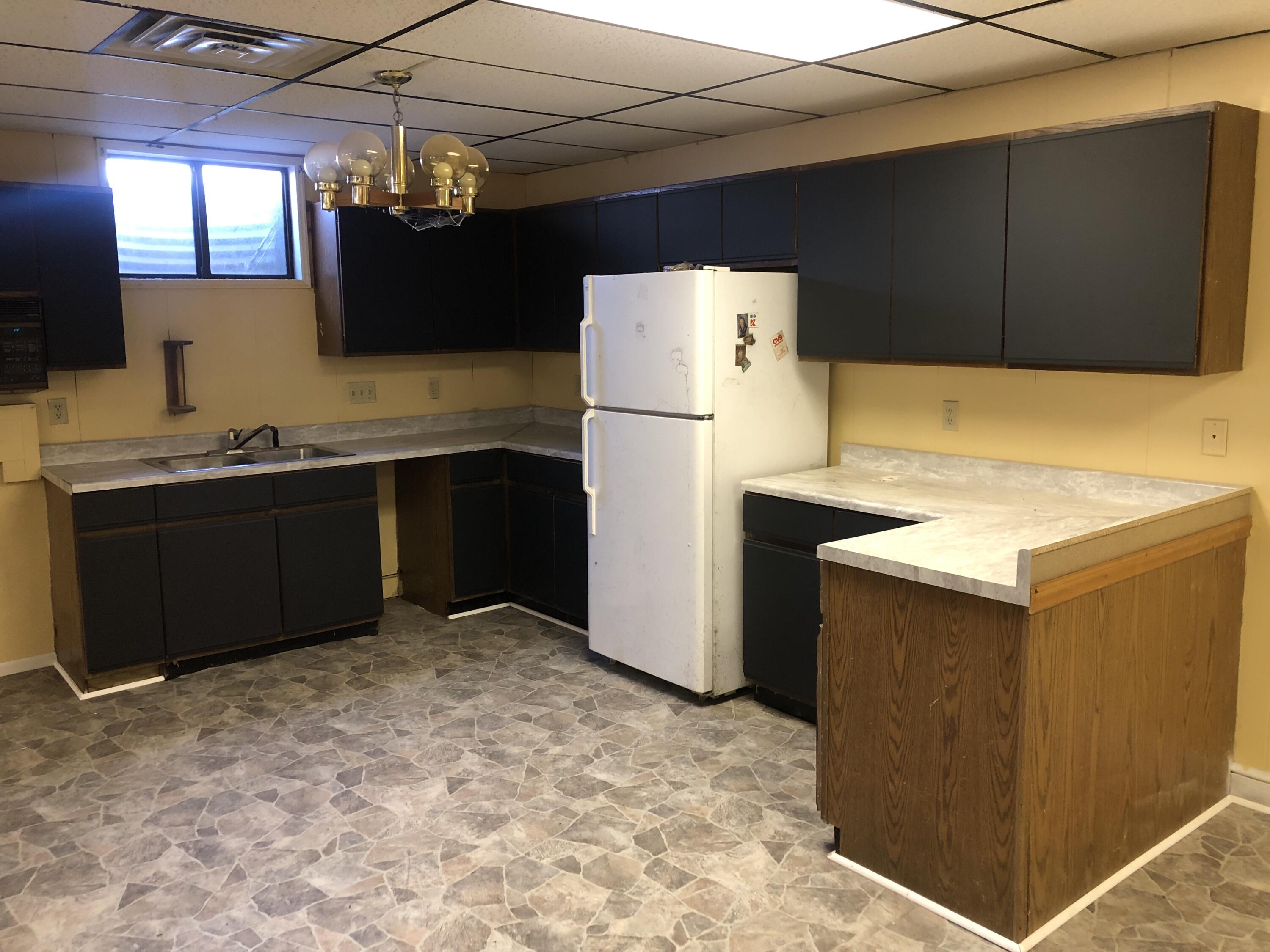 9210 Potts Creek Road Covington, VA 24426 - Photo 26 of 32 a kitchen with a refrigerator and a sink
