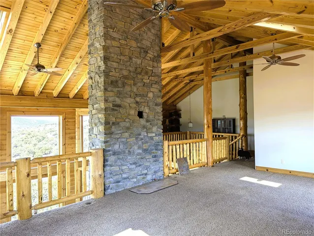 a view of a porch with a door and wooden floor