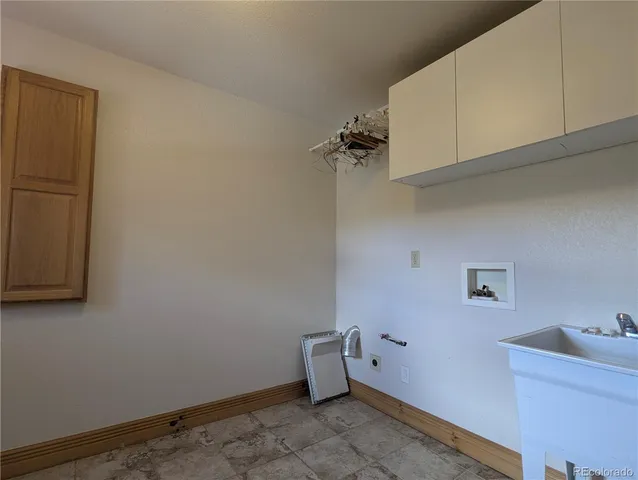a view of a livingroom with furniture and front door