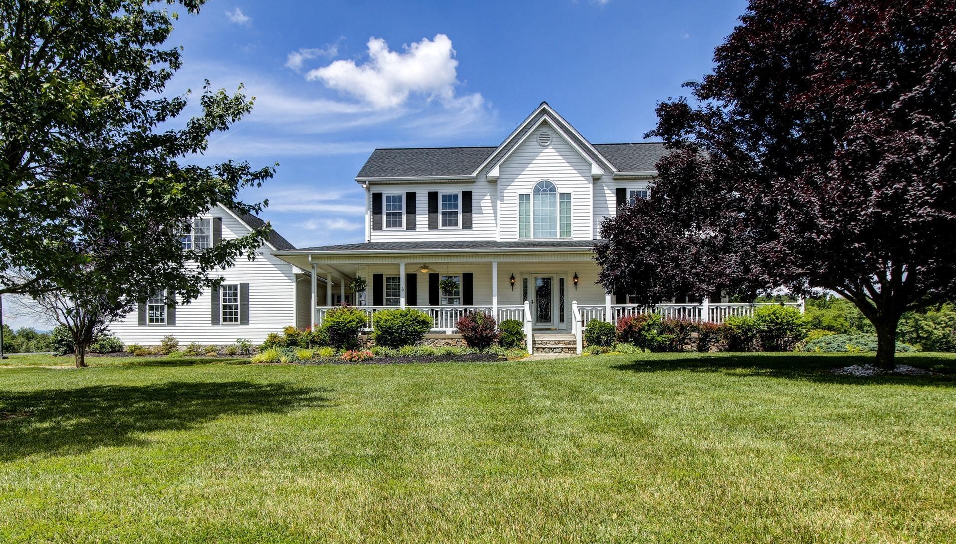 a front view of a house with a yard