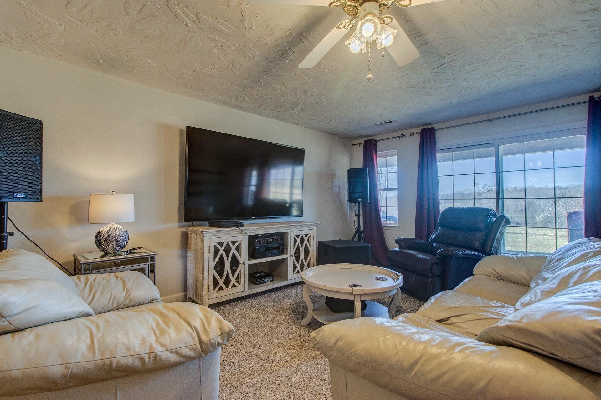 600 Dugwell Road Boones Mill, VA 24065 - Photo 15 of 78 a living room with furniture and a flat screen tv