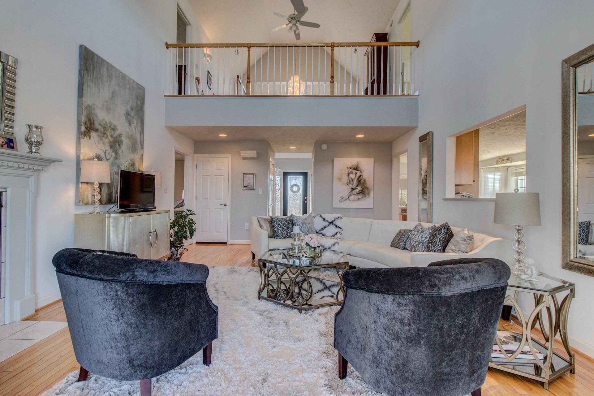 600 Dugwell Road Boones Mill, VA 24065 - Photo 30 of 78 a living room with furniture a flat screen tv and a chandelier
