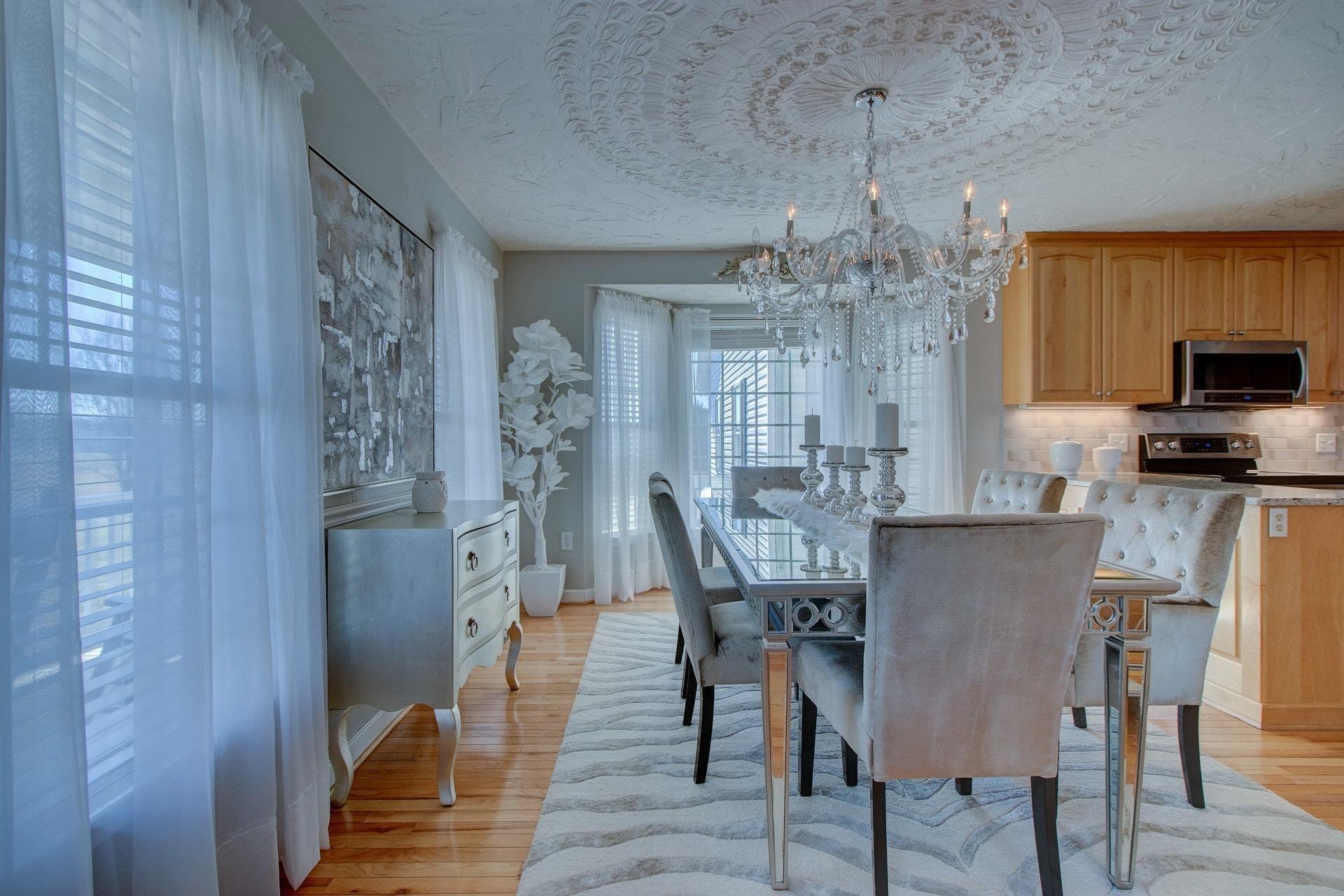 600 Dugwell Road Boones Mill, VA 24065 - Photo 32 of 78 a view of a dining room with furniture a chandelier and wooden floor