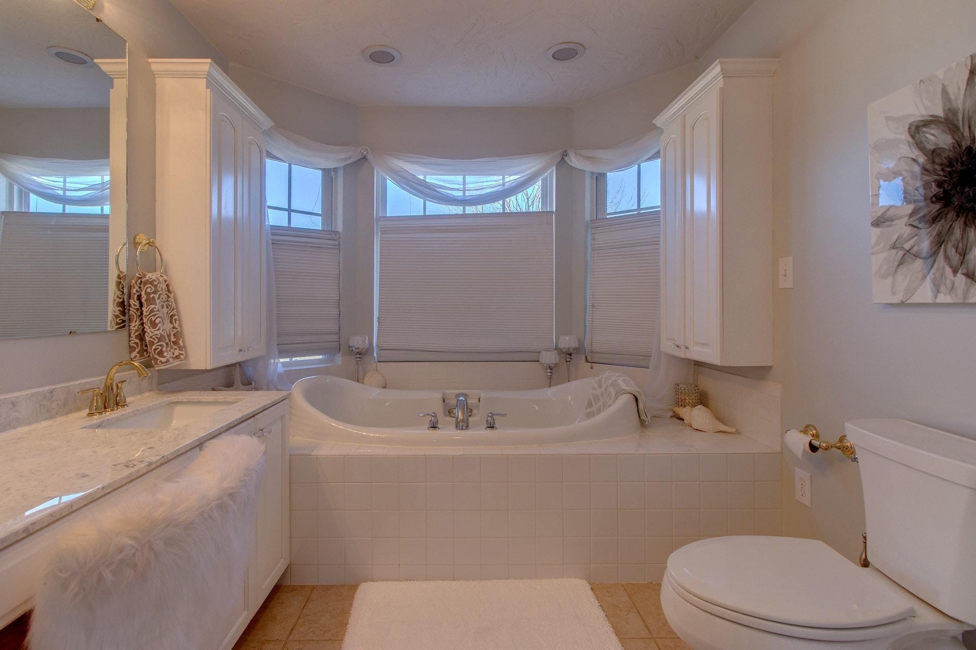 600 Dugwell Road Boones Mill, VA 24065 - Photo 45 of 78 a bathroom with a sink a toilet and a large mirror