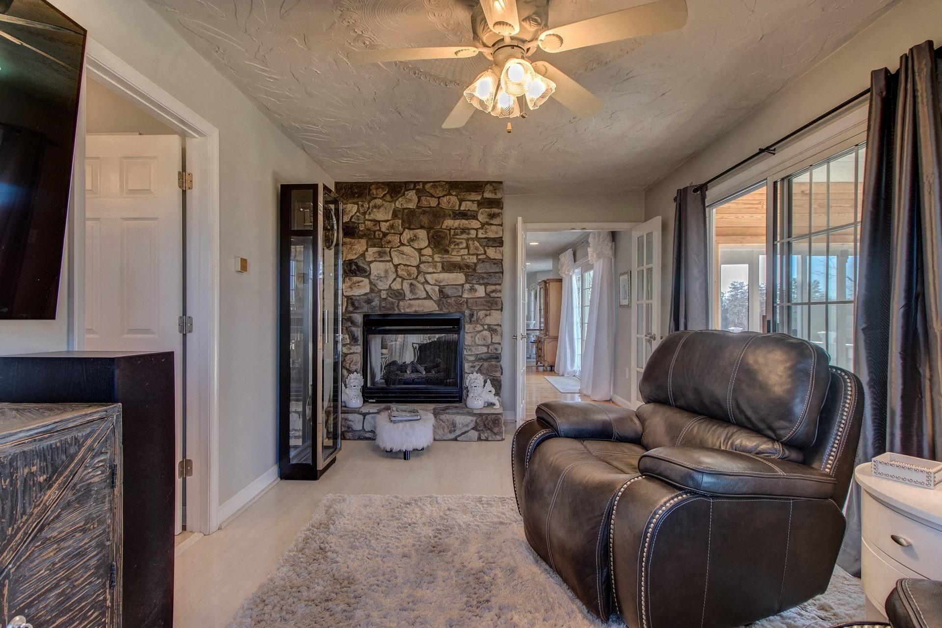 600 Dugwell Road Boones Mill, VA 24065 - Photo 46 of 78 a living room with furniture and a fireplace