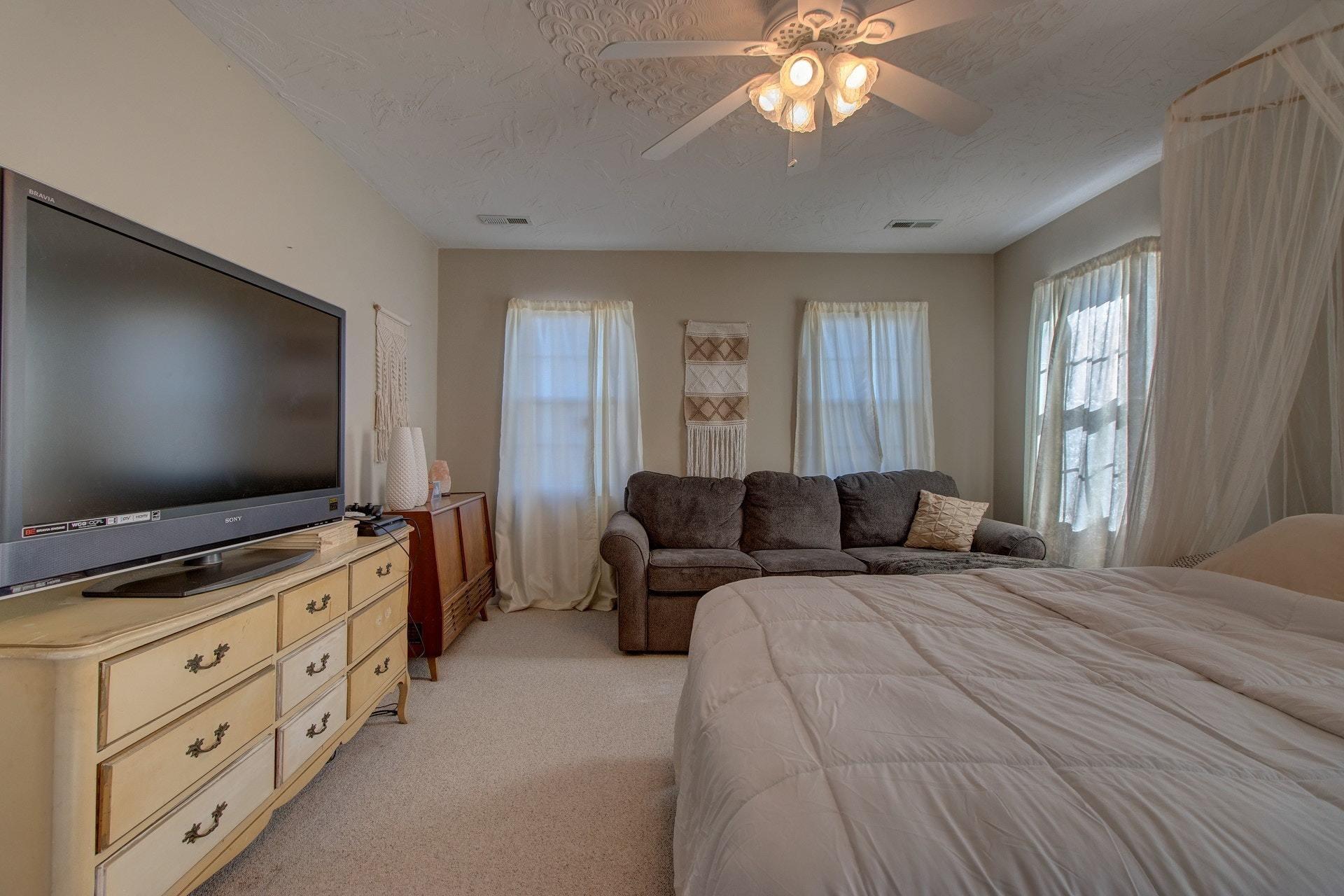 600 Dugwell Road Boones Mill, VA 24065 - Photo 53 of 78 a bedroom with furniture and a flat screen tv