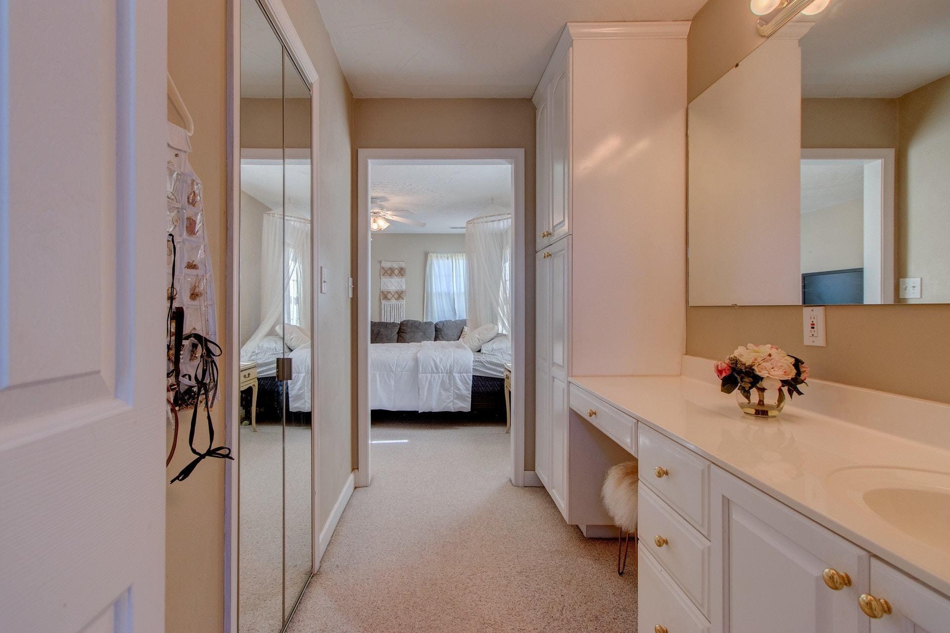 600 Dugwell Road Boones Mill, VA 24065 - Photo 55 of 78 a spacious en suite bathroom with a double vanity sink and mirror