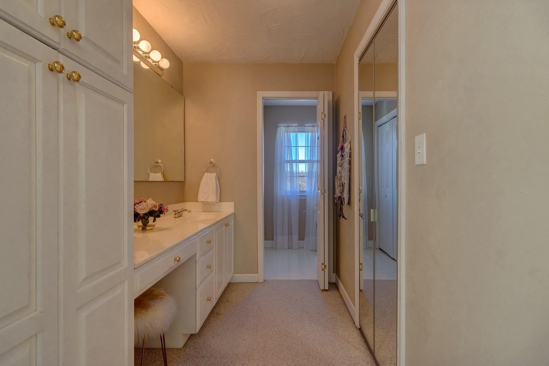 600 Dugwell Road Boones Mill, VA 24065 - Photo 56 of 78 a bathroom with a double vanity sink mirror and shower
