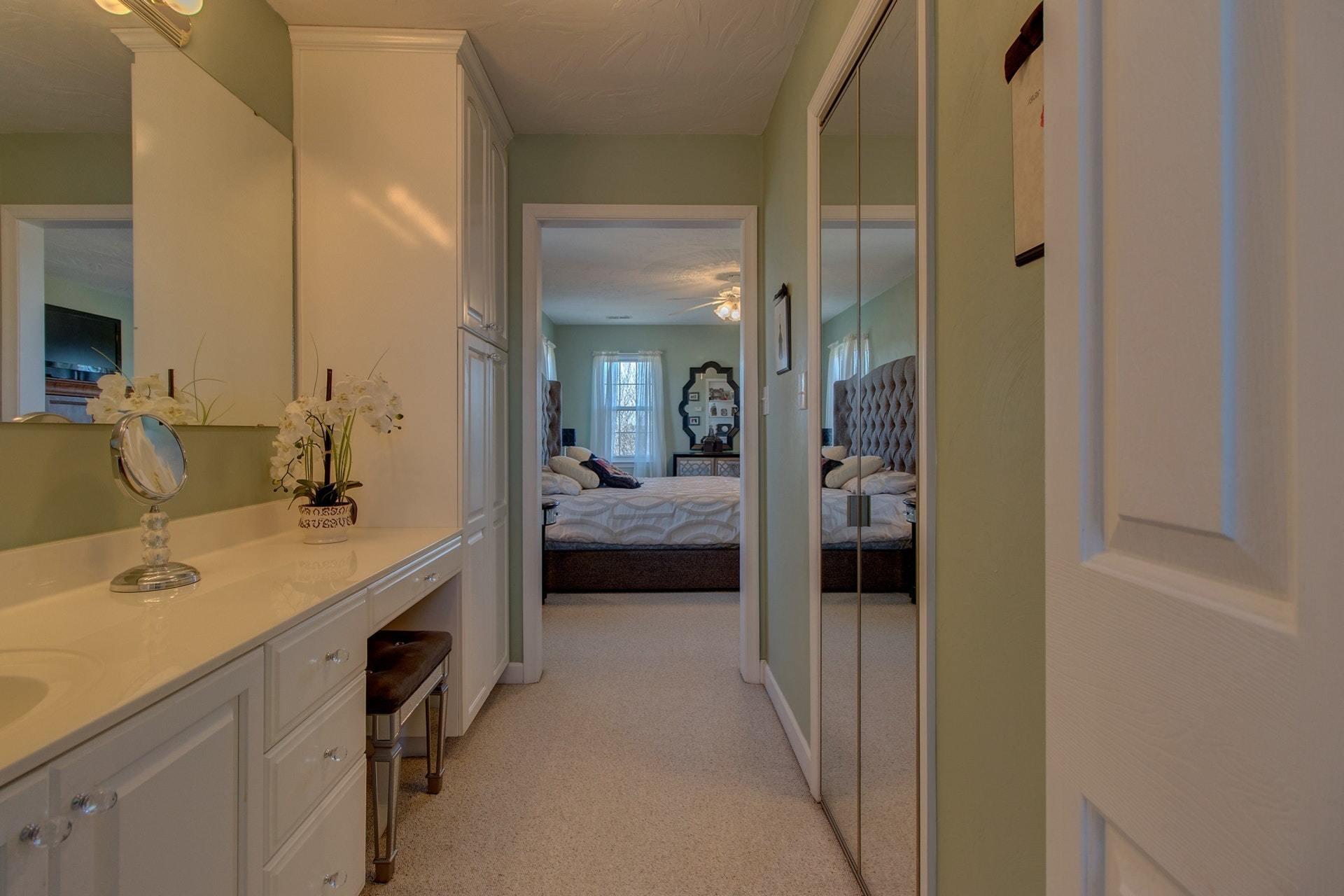 600 Dugwell Road Boones Mill, VA 24065 - Photo 62 of 78 a en suite bathroom with a double vanity sink and mirror