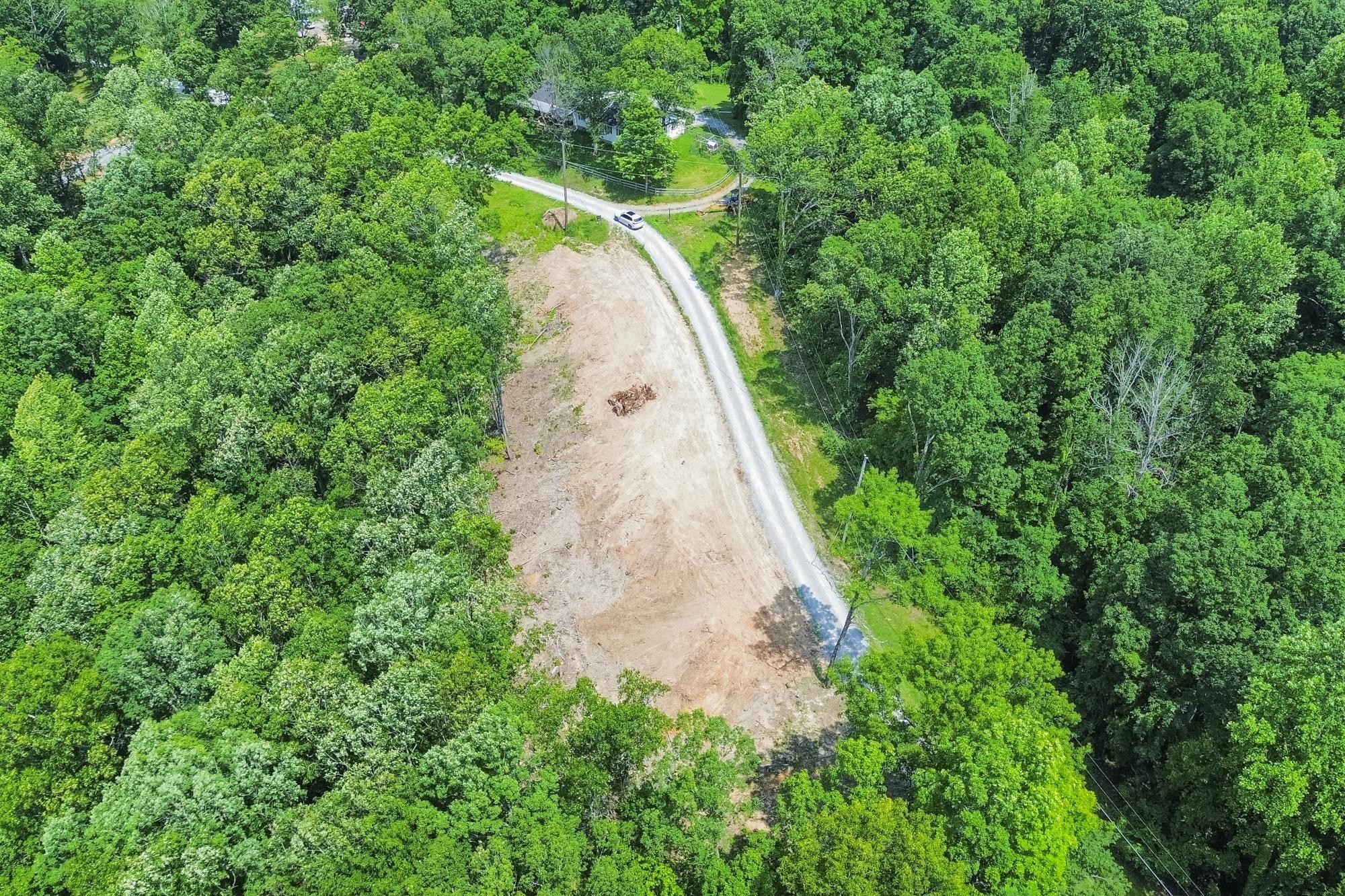 5590 Higdon Road Joelton, TN 37080 - Photo 16 of 40 an aerial view of a house with a yard and large trees