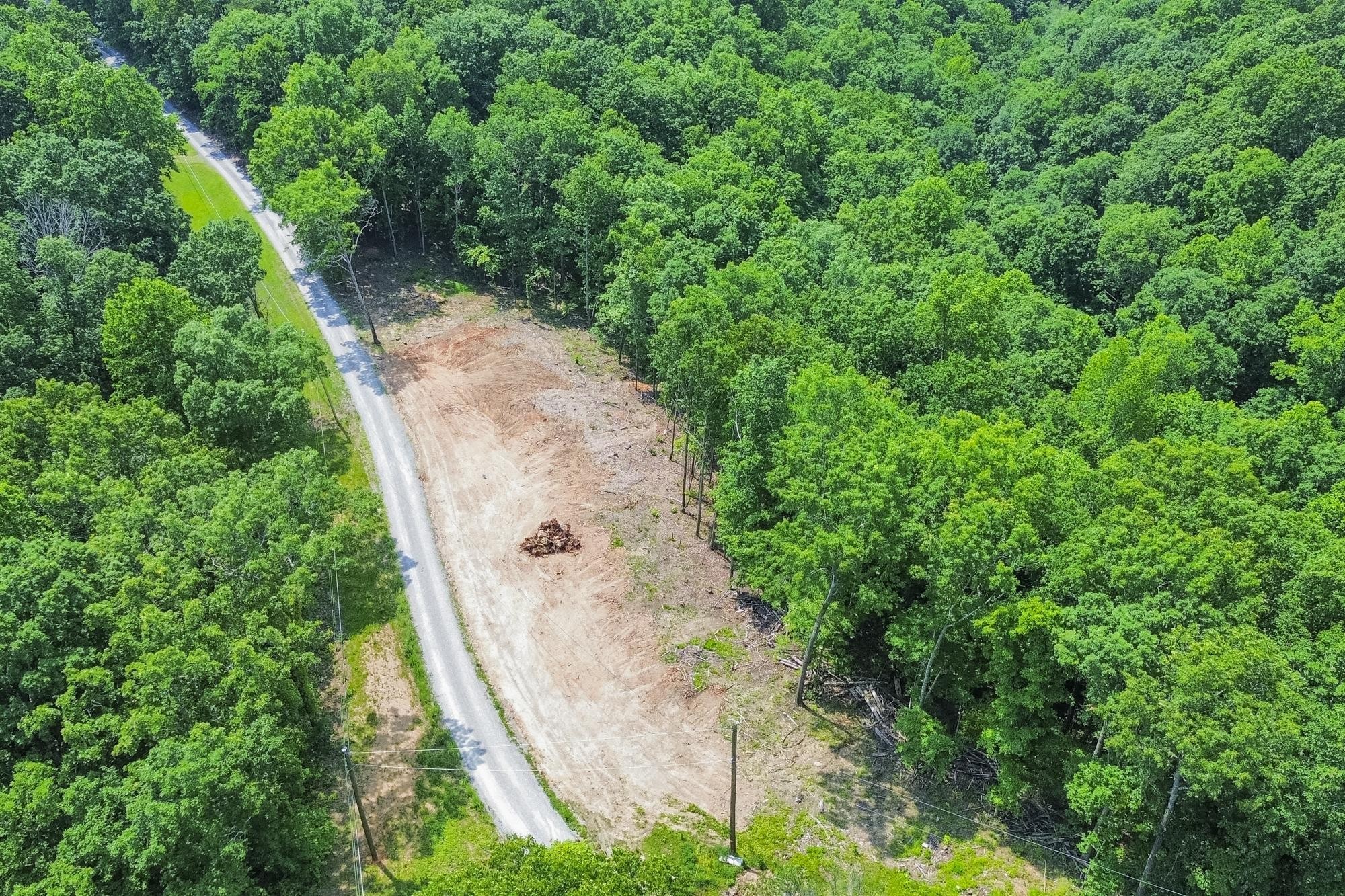 5590 Higdon Road Joelton, TN 37080 - Photo 17 of 40 an aerial view of a house with a yard and large trees