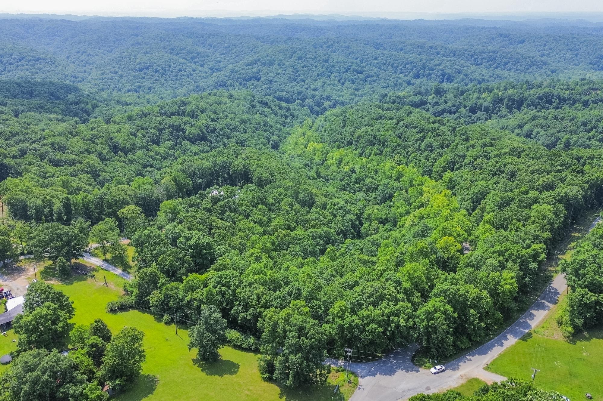 5590 Higdon Road Joelton, TN 37080 - Photo 32 of 40 a view of a garden with a lake