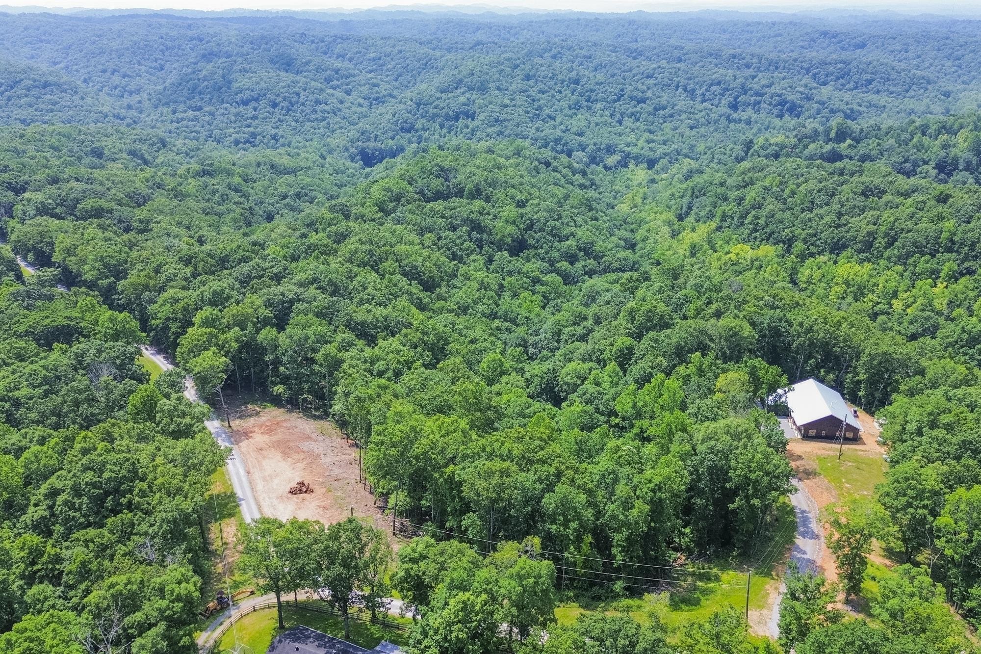 5590 Higdon Road Joelton, TN 37080 - Photo 35 of 40 an aerial view of a house with a yard and lake view