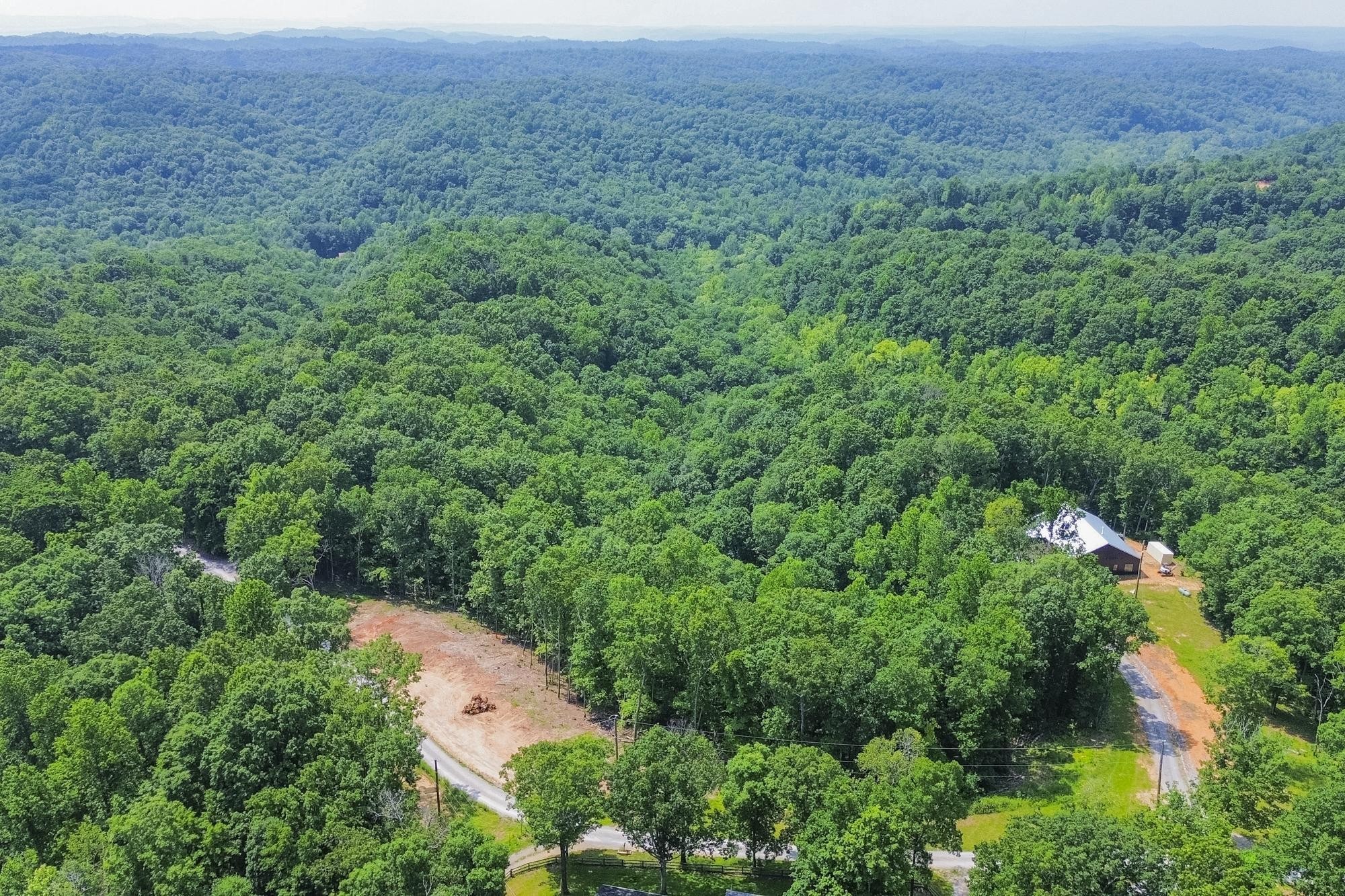 5590 Higdon Road Joelton, TN 37080 - Photo 4 of 40 an aerial view of residential house with outdoor space and trees all around