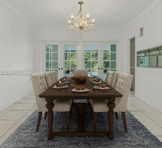 an empty room with windows and fireplace