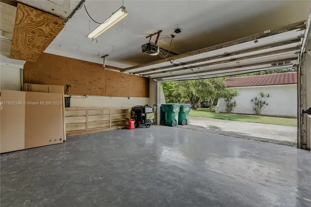 a white bench sitting in front of a house