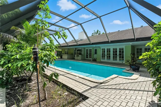a view of a swimming pool with a patio
