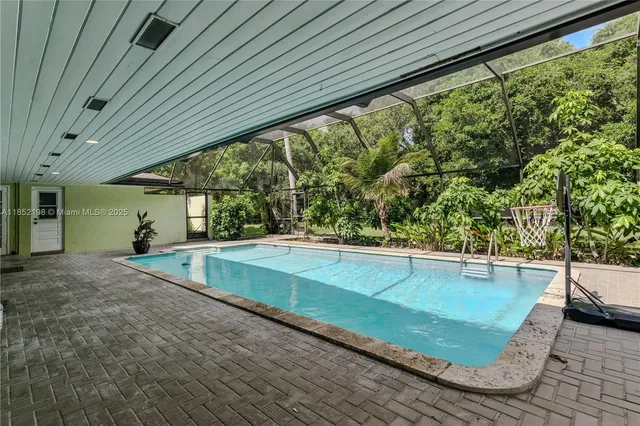 a view of green field with sitting area