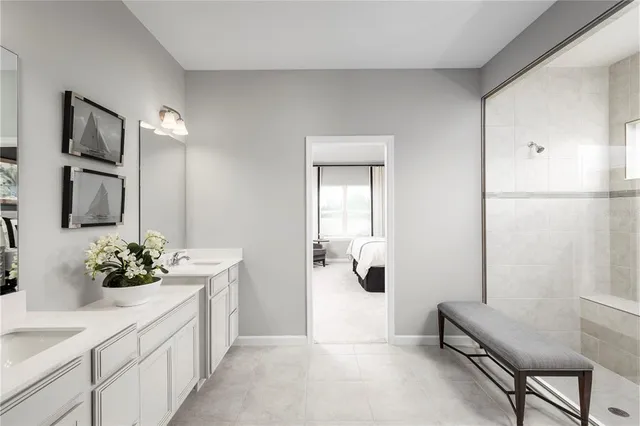 a bathroom with a sink vanity and a mirror