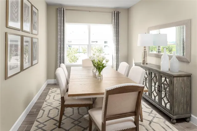a view of a dining room with furniture window and outside view
