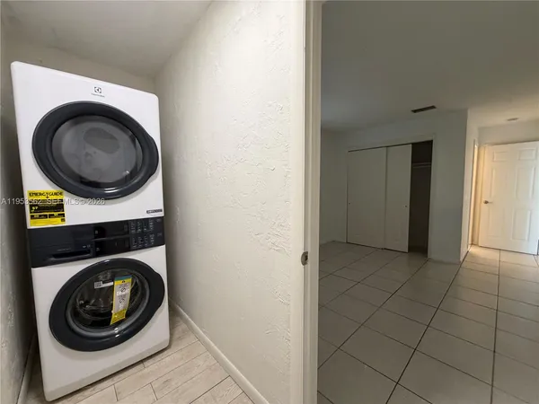 a view of a storage & utility room with washer and dryer