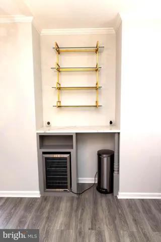 a view of an empty room with a fireplace and a window