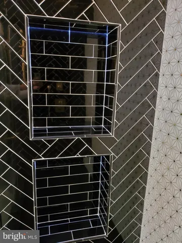 a bathroom with a mirror and a shower