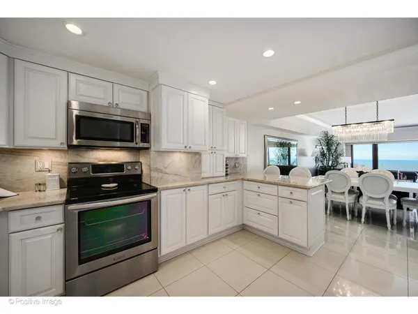 a kitchen with a sink cabinets and stainless steel appliances
