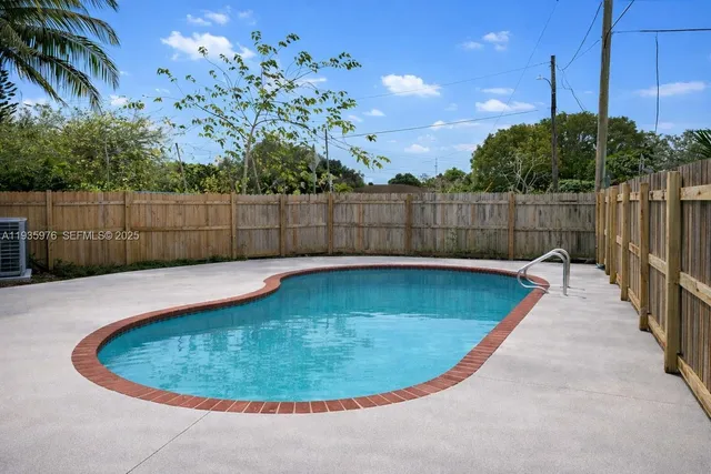 a view of a backyard with a small cabin