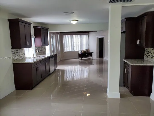 a lobby with furniture and window