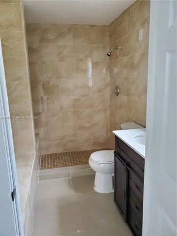 a bathroom with a sink and toilet