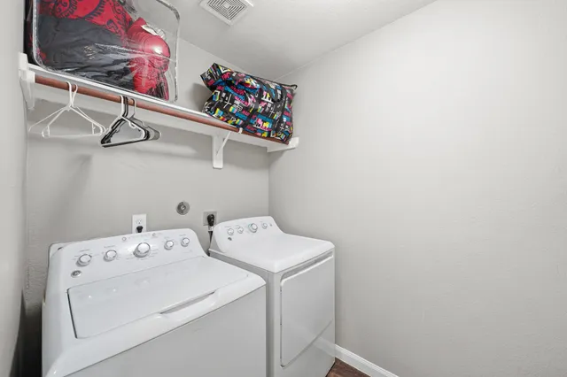 a utility room with dryer and washer