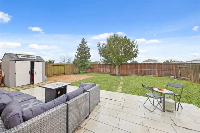 a view of yard with furniture and outdoor area