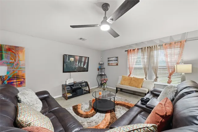 a living room with furniture and a window