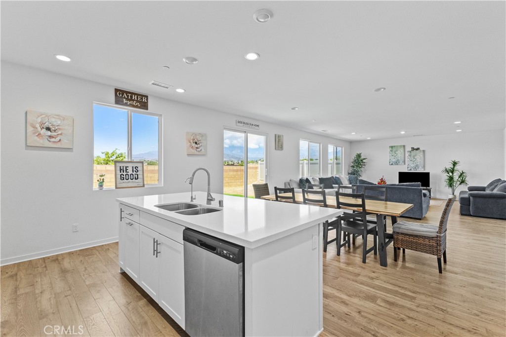 36780 Arietta Way Beaumont, CA 92223 - Photo 12 of 44 a kitchen with a sink cabinets and wooden floor