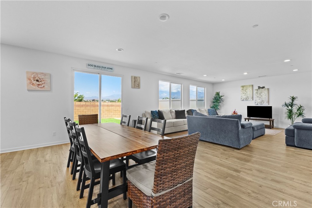36780 Arietta Way Beaumont, CA 92223 - Photo 14 of 44 a living room with furniture a wooden floor and a flat screen tv