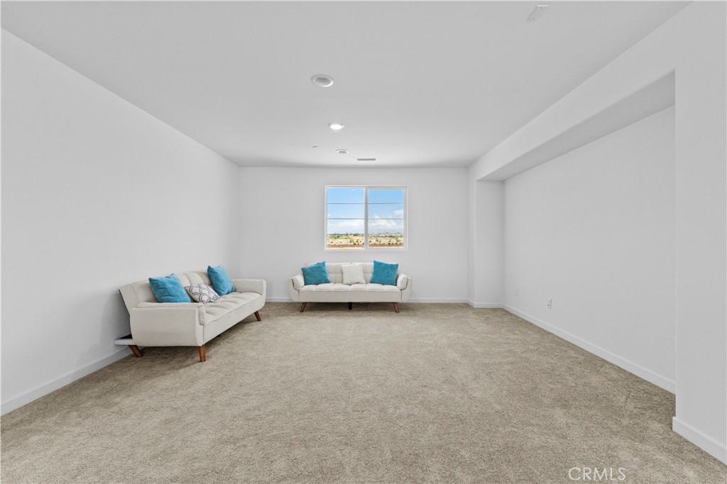 36780 Arietta Way Beaumont, CA 92223 - Photo 18 of 44 a view of an empty room with a window