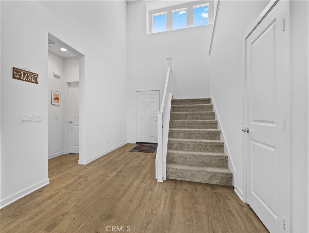 36780 Arietta Way Beaumont, CA 92223 - Photo 4 of 44 a view of an entryway with wooden floor