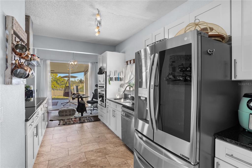 2619 Rangeley Court Orlando, FL 32835 - Photo 21 of 59 a kitchen with stainless steel appliances a refrigerator and a stove