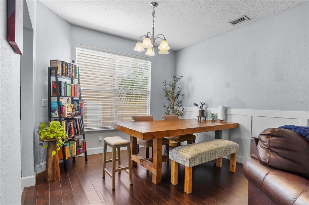 2619 Rangeley Court Orlando, FL 32835 - Photo 24 of 59 a view of a dining room with furniture window and wooden floor