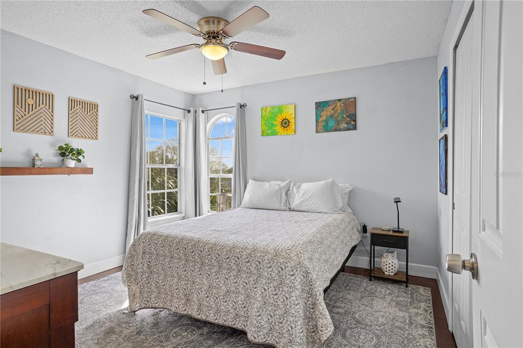 2619 Rangeley Court Orlando, FL 32835 - Photo 39 of 59 a bedroom with a bed and a chandelier