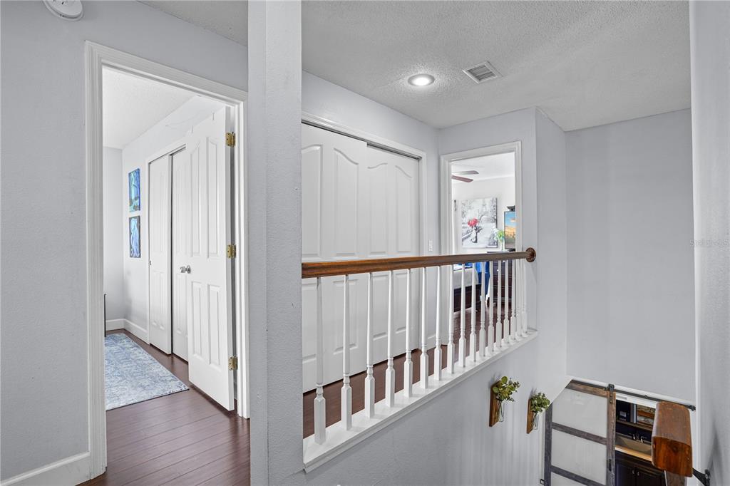 2619 Rangeley Court Orlando, FL 32835 - Photo 42 of 59 a view of a hallway with wooden floor and windows